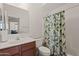 Clean bathroom with shower/tub combo and wood vanity at 8912 S 40Th Dr, Laveen, AZ 85339