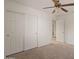 Spacious bedroom with double door closet and ceiling fan at 8912 S 40Th Dr, Laveen, AZ 85339