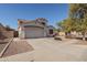 Two-story house with a large garage and well-manicured front yard at 8912 S 40Th Dr, Laveen, AZ 85339