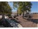 Two-story house with mature trees and a landscaped yard at 8912 S 40Th Dr, Laveen, AZ 85339