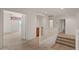 Upstairs hallway with carpet and doors to bedrooms at 8912 S 40Th Dr, Laveen, AZ 85339