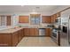 Modern kitchen with stainless steel appliances and ample cabinetry at 8912 S 40Th Dr, Laveen, AZ 85339