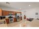 Spacious kitchen featuring stainless steel appliances and a breakfast bar at 8912 S 40Th Dr, Laveen, AZ 85339