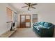 Living room featuring a sofa and shelving unit at 8912 S 40Th Dr, Laveen, AZ 85339