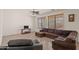 Relaxing living room featuring a sectional sofa and ceiling fan at 8912 S 40Th Dr, Laveen, AZ 85339