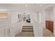 Spacious loft area with a seating area and built-in cabinets at 8912 S 40Th Dr, Laveen, AZ 85339