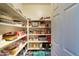 Well-organized pantry with plenty of shelving for storage at 8912 S 40Th Dr, Laveen, AZ 85339