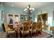 Elegant dining room featuring a large table and chandelier at 8945 N Cordoniz Ln, Casa Grande, AZ 85194