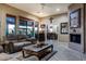 Living room with stone fireplace and view into dining area at 8945 N Cordoniz Ln, Casa Grande, AZ 85194