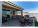 Covered patio with seating area and dining table at 10815 S 175Th Dr, Goodyear, AZ 85338