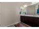 Bathroom boasts double sinks and dark brown vanity at 10815 S 175Th Dr, Goodyear, AZ 85338