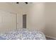 Bedroom with a white door and ceiling fan at 10815 S 175Th Dr, Goodyear, AZ 85338