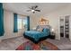 Spacious bedroom with teal bedding and walk-in closet at 10815 S 175Th Dr, Goodyear, AZ 85338