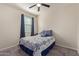 Bedroom with a blue and white patterned bedspread at 10815 S 175Th Dr, Goodyear, AZ 85338