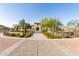 Exterior of a beautiful community clubhouse with landscaping at 10815 S 175Th Dr, Goodyear, AZ 85338