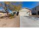 One-story house with a two-car garage and landscaped front yard at 10815 S 175Th Dr, Goodyear, AZ 85338