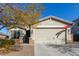 One-story house with a two-car garage and American flag at 10815 S 175Th Dr, Goodyear, AZ 85338