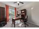 Home office with desk, chairs, and built-in shelving at 10815 S 175Th Dr, Goodyear, AZ 85338