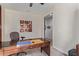 Home office with desk, chair, and artwork at 10815 S 175Th Dr, Goodyear, AZ 85338