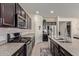 Modern kitchen with dark cabinets, granite counters and island at 10815 S 175Th Dr, Goodyear, AZ 85338
