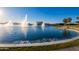 Lake with several water fountains and palm trees at 10815 S 175Th Dr, Goodyear, AZ 85338