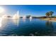 Calm lake scene with multiple water fountains at 10815 S 175Th Dr, Goodyear, AZ 85338