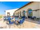 Outdoor patio area with blue chairs and tables at 10815 S 175Th Dr, Goodyear, AZ 85338