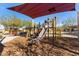 Modern playground with slide and shade structure at 10815 S 175Th Dr, Goodyear, AZ 85338