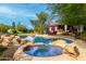 Relaxing backyard oasis with a pool and spa at 1103 E Kael Cir, Mesa, AZ 85203