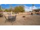 The backyard has a patio, a table and an open-air BBQ at 11606 W Laurelwood Ln, Avondale, AZ 85392