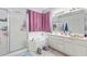 Bright bathroom features shower, soaking tub and vanity at 11606 W Laurelwood Ln, Avondale, AZ 85392