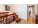 Cozy bedroom features a crib, rocking chair, and closet with sliding doors at 11606 W Laurelwood W Ln, Avondale, AZ 85392