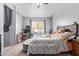 Cozy bedroom with natural light from the window and plush carpeting at 11606 W Laurelwood Ln, Avondale, AZ 85392
