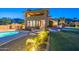 Expansive backyard featuring a pool, patio area, and meticulously maintained landscaping at 12015 S Tuzigoot Dr, Phoenix, AZ 85044