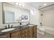Bathroom featuring a double vanity, elegant fixtures, and decorative accents at 12015 S Tuzigoot Dr, Phoenix, AZ 85044