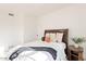 Bedroom featuring a wood headboard bed, a white duvet, and a wood side table at 12015 S Tuzigoot Dr, Phoenix, AZ 85044