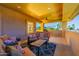 View of the large covered patio with comfortable furniture, a ceiling fan, and lovely outdoor views at 12015 S Tuzigoot Dr, Phoenix, AZ 85044
