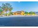 Beautiful home exterior featuring desert landscaping, a three-car garage, and a well-lit entrance at 12015 S Tuzigoot Dr, Phoenix, AZ 85044