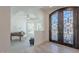 Grand foyer showcasing an ornate entry door, high ceilings, and a glimpse of the living area at 12015 S Tuzigoot Dr, Phoenix, AZ 85044