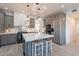 Well-designed kitchen with an island, breakfast bar, marble accents, and modern fixtures at 12015 S Tuzigoot Dr, Phoenix, AZ 85044