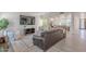 Inviting living room with modern decor, wood floors, and a view of the dining area at 12015 S Tuzigoot Dr, Phoenix, AZ 85044