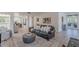 Comfortable living area featuring a leather sofa, stylish rug, and an open layout at 12015 S Tuzigoot Dr, Phoenix, AZ 85044