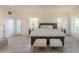 Large main bedroom offers a serene retreat with natural light and neutral décor at 12015 S Tuzigoot Dr, Phoenix, AZ 85044