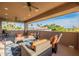 This covered patio offers views and comfortable seating, perfect for relaxation and entertaining at 12015 S Tuzigoot Dr, Phoenix, AZ 85044