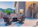 Outdoor patio area with a fire pit, seating, and a spiral staircase at 12015 S Tuzigoot Dr, Phoenix, AZ 85044