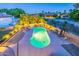 Aerial view of an in-ground pool with turtles painted on the bottom, a patio, and desert landscaping at 12015 S Tuzigoot Dr, Phoenix, AZ 85044