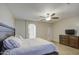 Main bedroom with a king-size bed and en-suite bathroom at 12226 W Miami St, Tolleson, AZ 85353