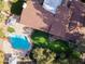 Aerial view showcasing a kidney-shaped pool and lush landscaping at 12286 N 86Th Pl, Scottsdale, AZ 85260