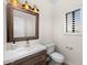 Updated bathroom with modern vanity, mirror, and toilet at 12286 N 86Th Pl, Scottsdale, AZ 85260