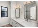 Bathroom with double vanity, quartz countertops, and modern fixtures at 12286 N 86Th Pl, Scottsdale, AZ 85260